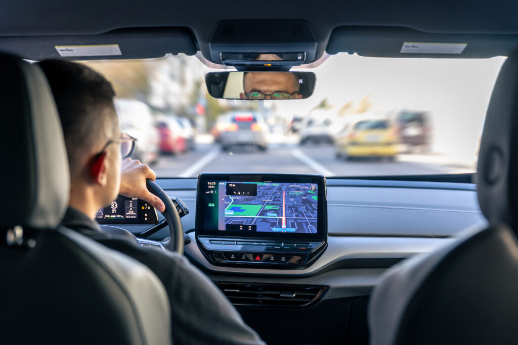 man-touching-screen-gps-navigation-system-his-car